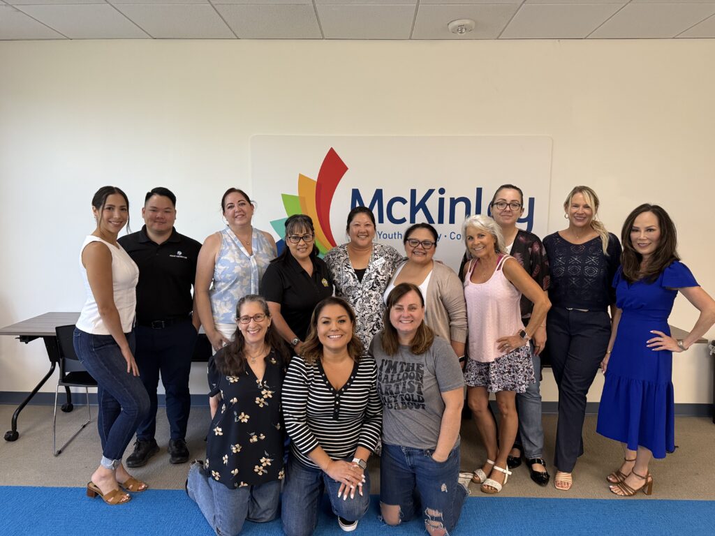 Women in Business Connections (WIBC) members gathered at McKinley in San Dimas, California, for a networking and collaboration meeting. The group of local women entrepreneurs and business professionals is pictured smiling in front of the McKinley logo, celebrating community, connection, and growth in the Inland Empire business network.